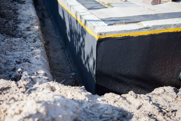 Professional Basement Waterproofing technician working in Manhasset, NY